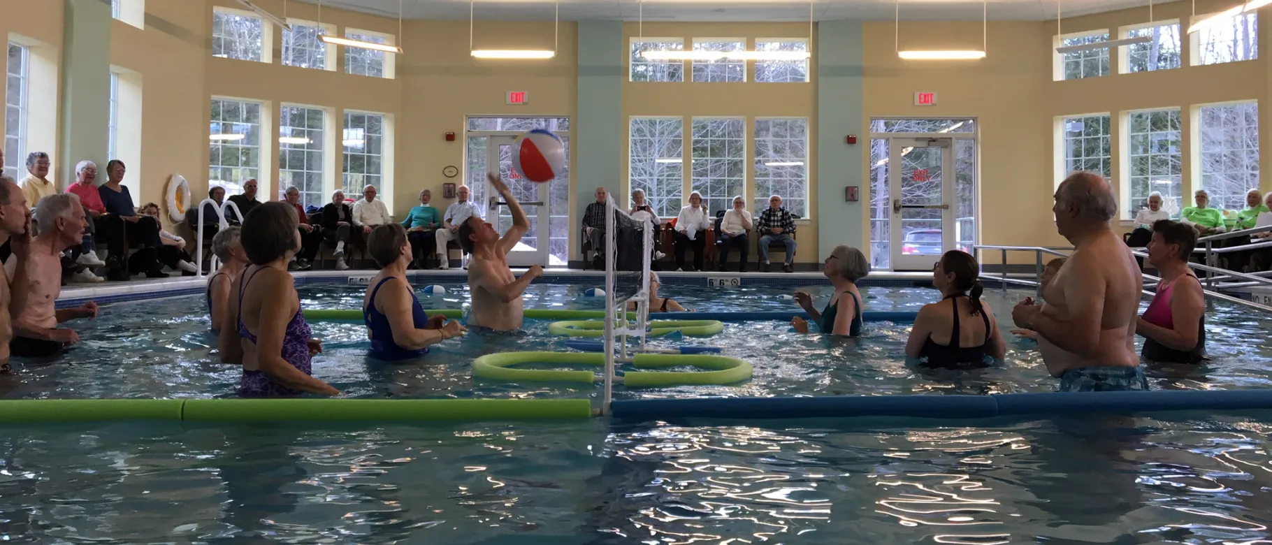 Older adults play water volleyball through U-ExCEL program