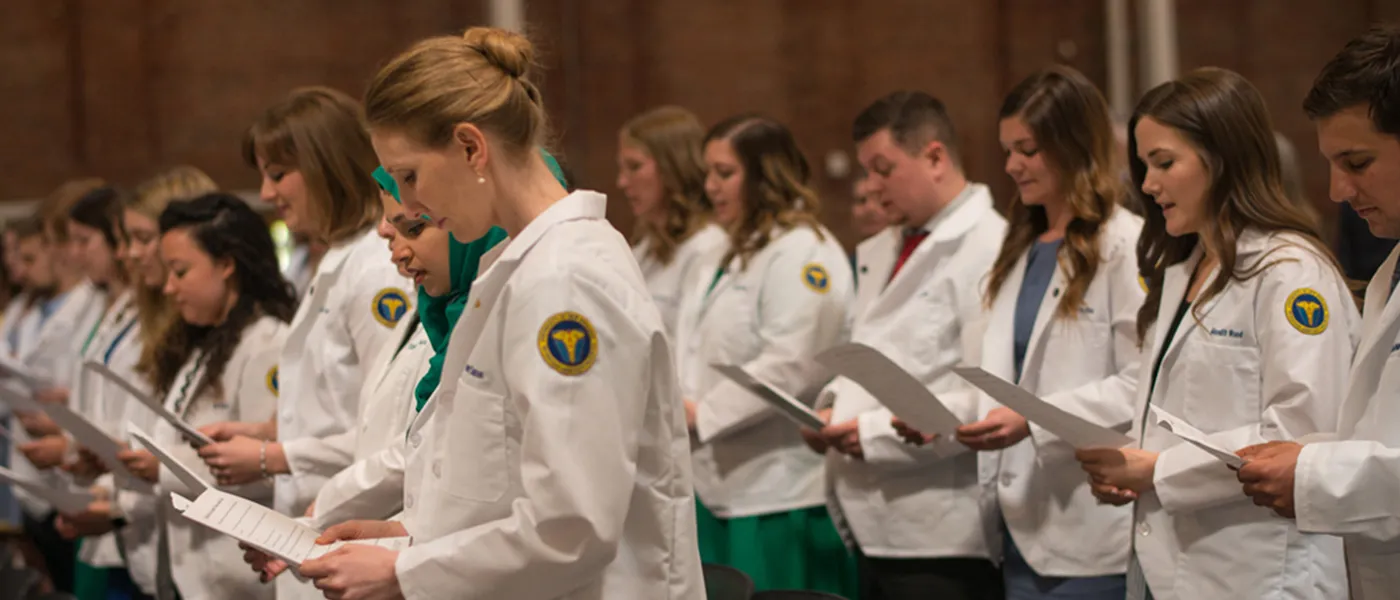 Physician Assistant degree program students taking oath.