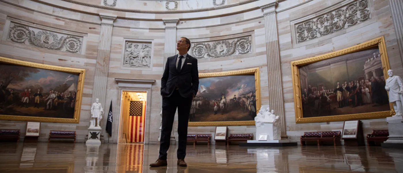 President James Herbert viewing paintings in the rotunda of the Capitol Building