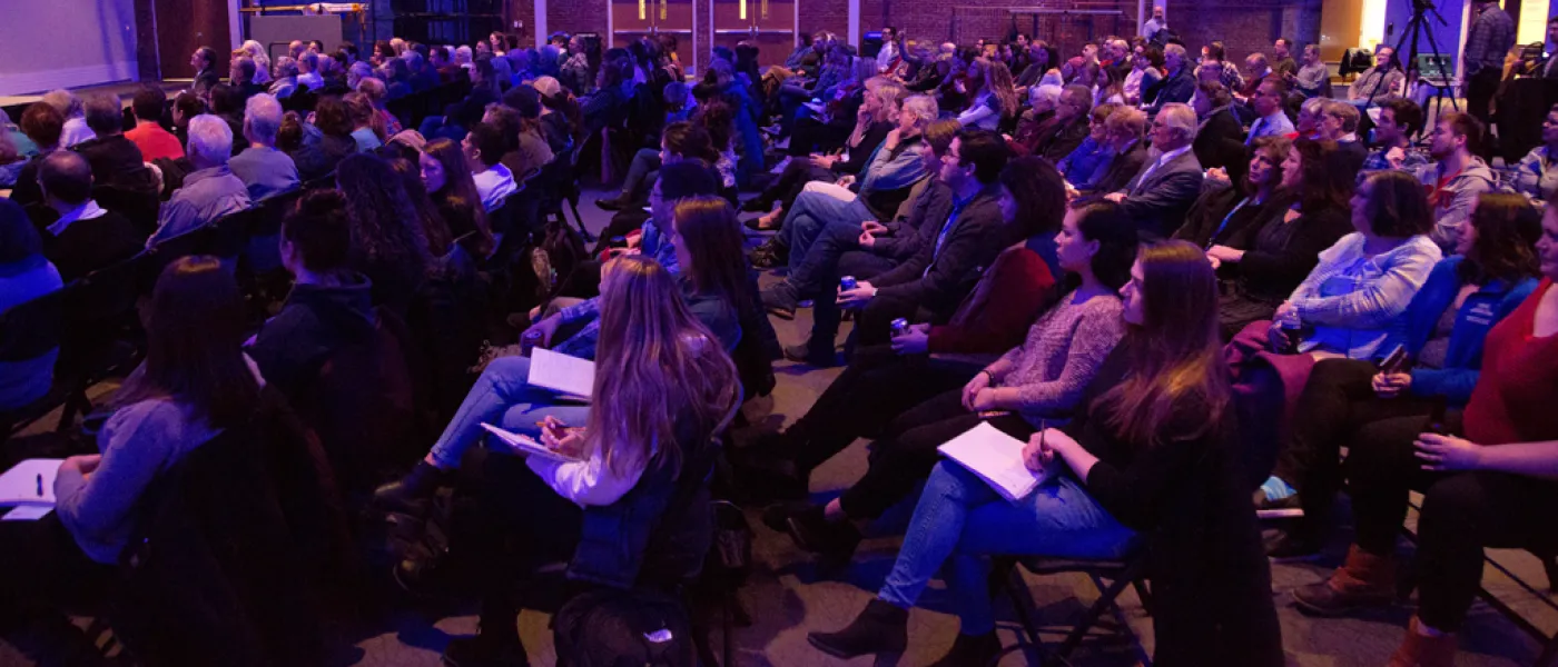 Seated crowd at a Center for Global Humanities event