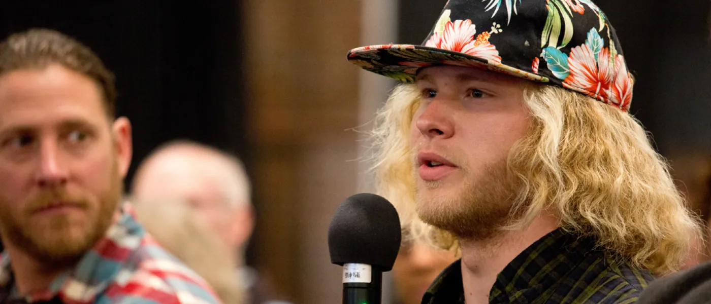 Student asking a question at a UNE event