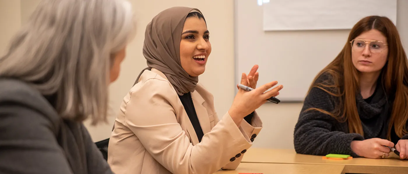 Three individuals discussing diversity in healthcare