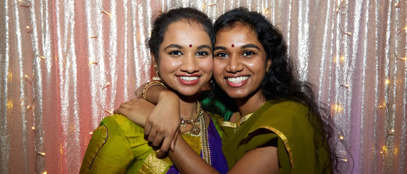 Two College of Osteopathic Medicine students embracing at the Diversity Gala