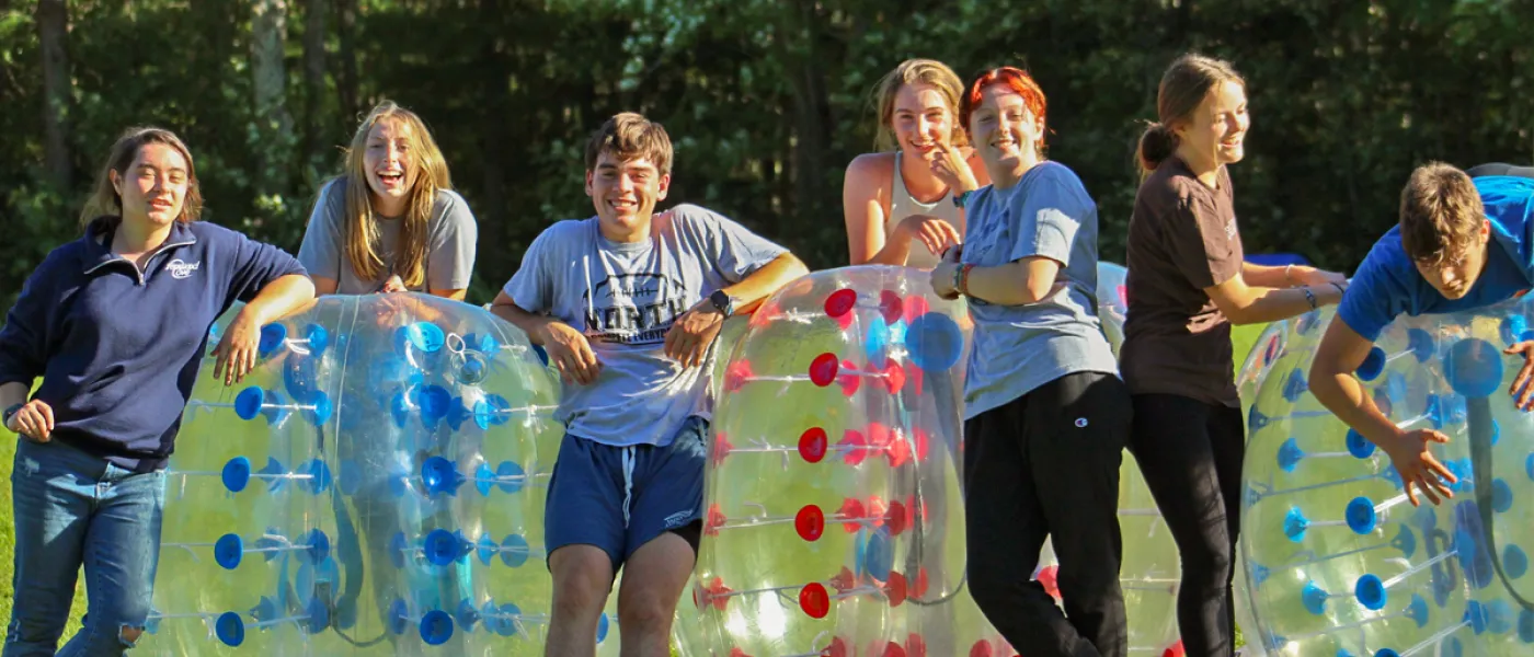 Students lined up to play bubble soccer