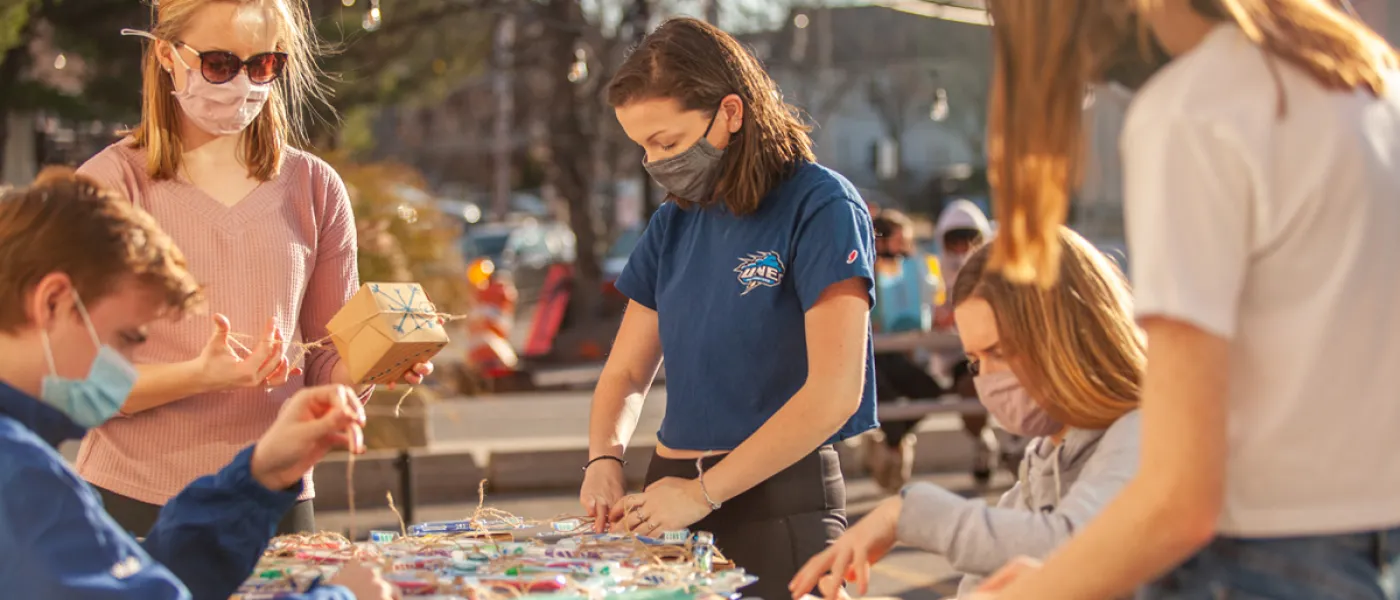 Students prepare to put string lights up around downtown Biddeford, Maine