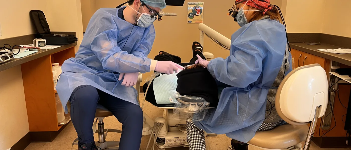 Dental students perform cleanings for children at the Oral Health Center's dental clinic