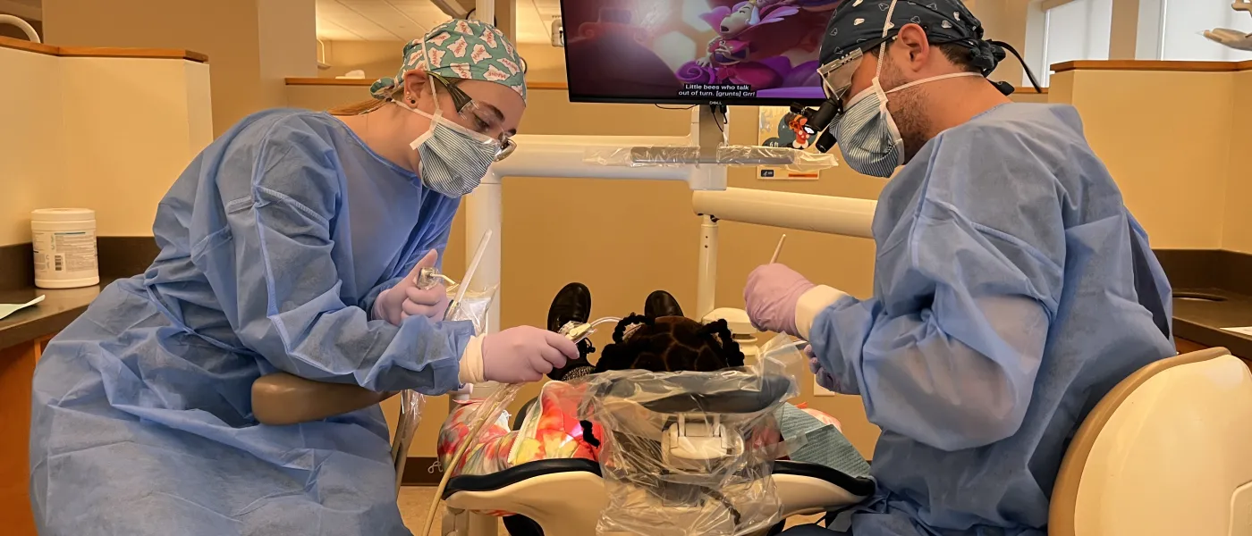 Dental students perform cleanings for children at the Oral Health Center's dental clinic