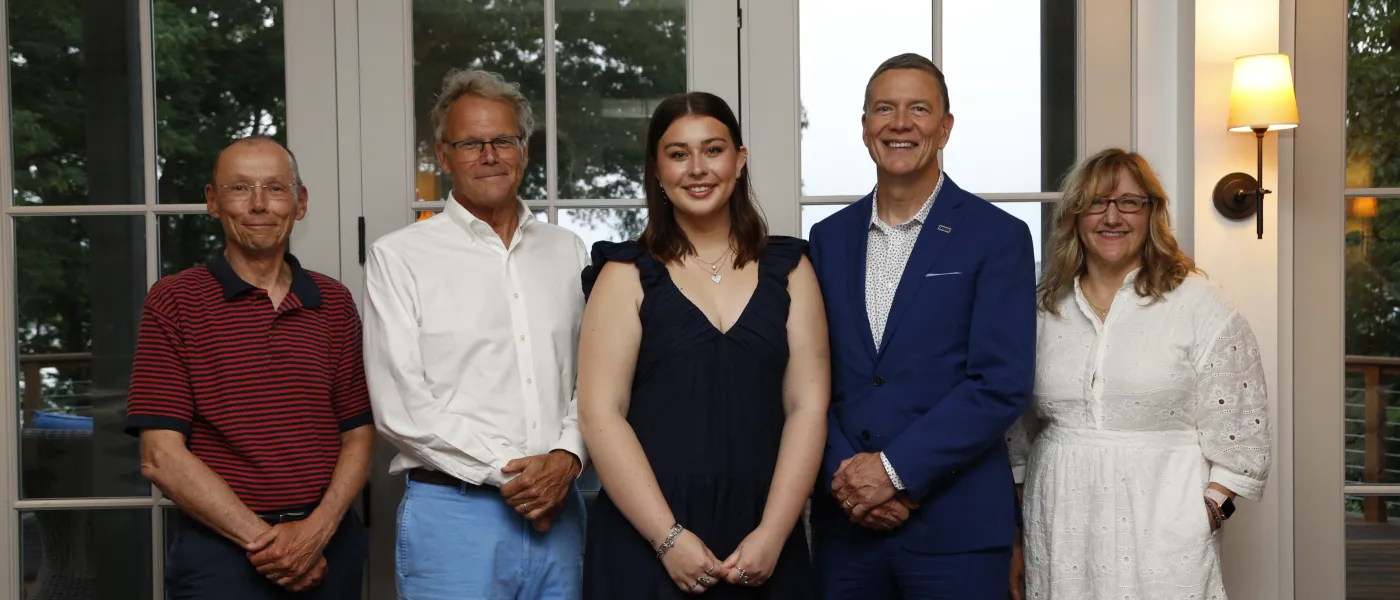 Abbie Anderson poses with President James Herbert, Justine Bassett, Michael Sheldon, and Ford Reiche