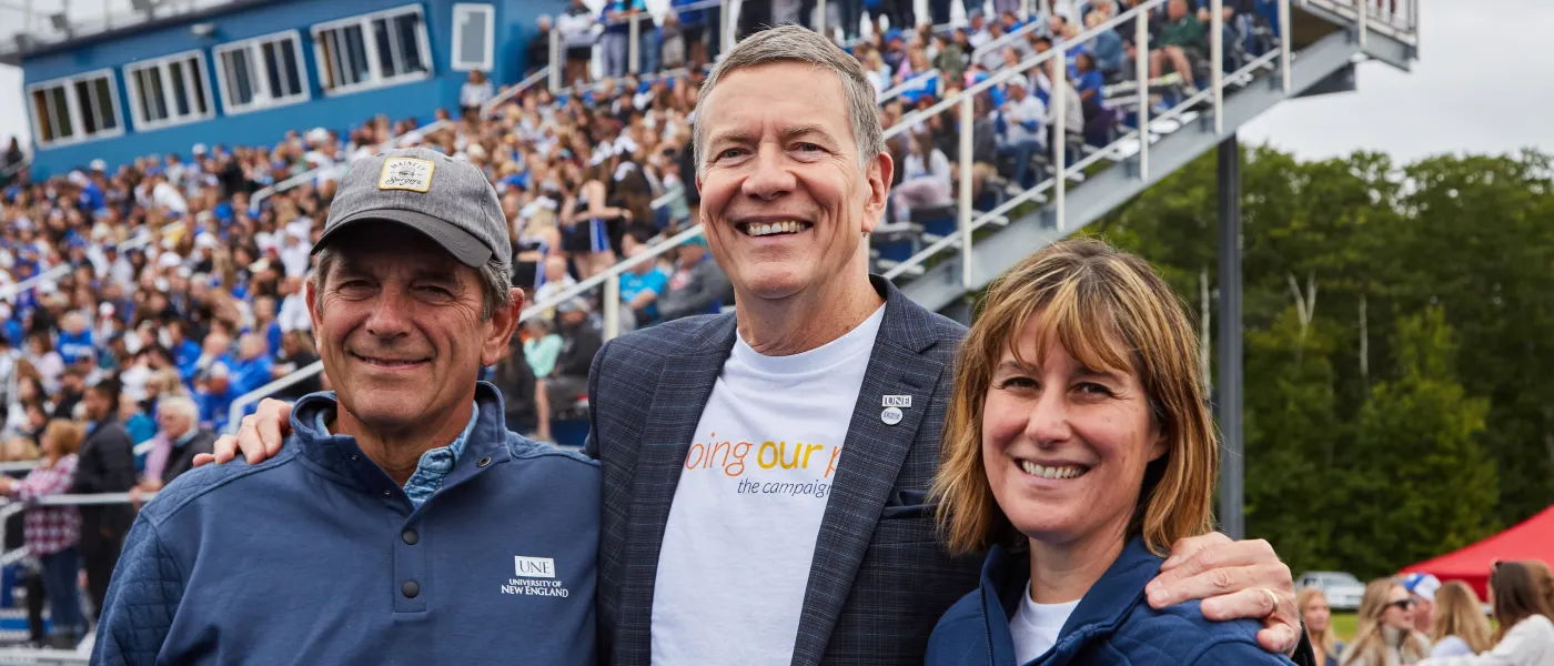 UNE President James Herbert poses with Alicia Fereday, vice president for Institutional Advancement, and David Barber