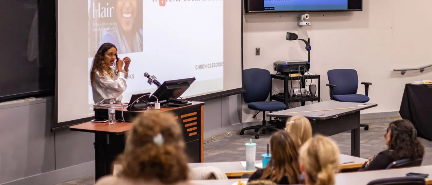 St. Clair Detrick-Jules speaks to U N E students at a lecture titled, "Black Hair and Storytelling as a Form of Activism"