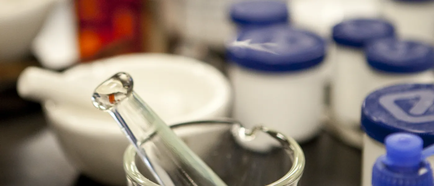 A mortar and pestle on a lab table 