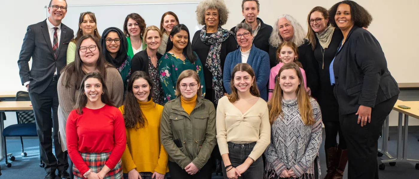 Angela Davis poses with U N E students