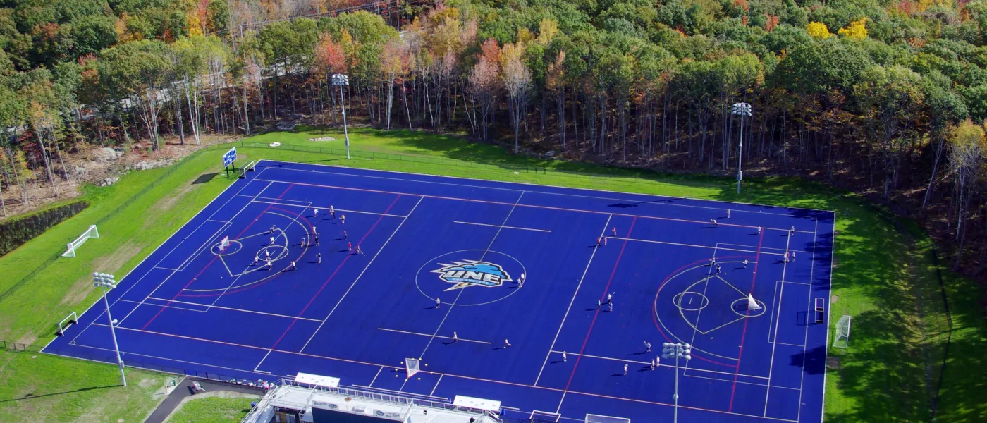 Aerial view of U N E's blue turf field