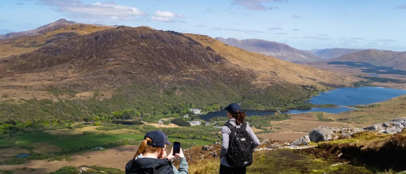 UNE Students overlooking Kylemoor Abbey in Ireland