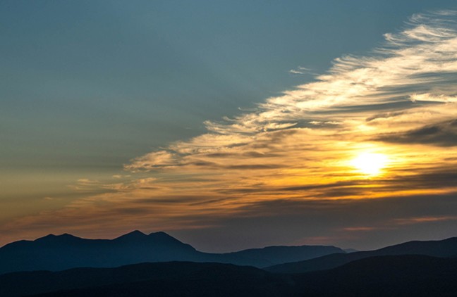 The sunrise over the Bigelow Preserve mountians