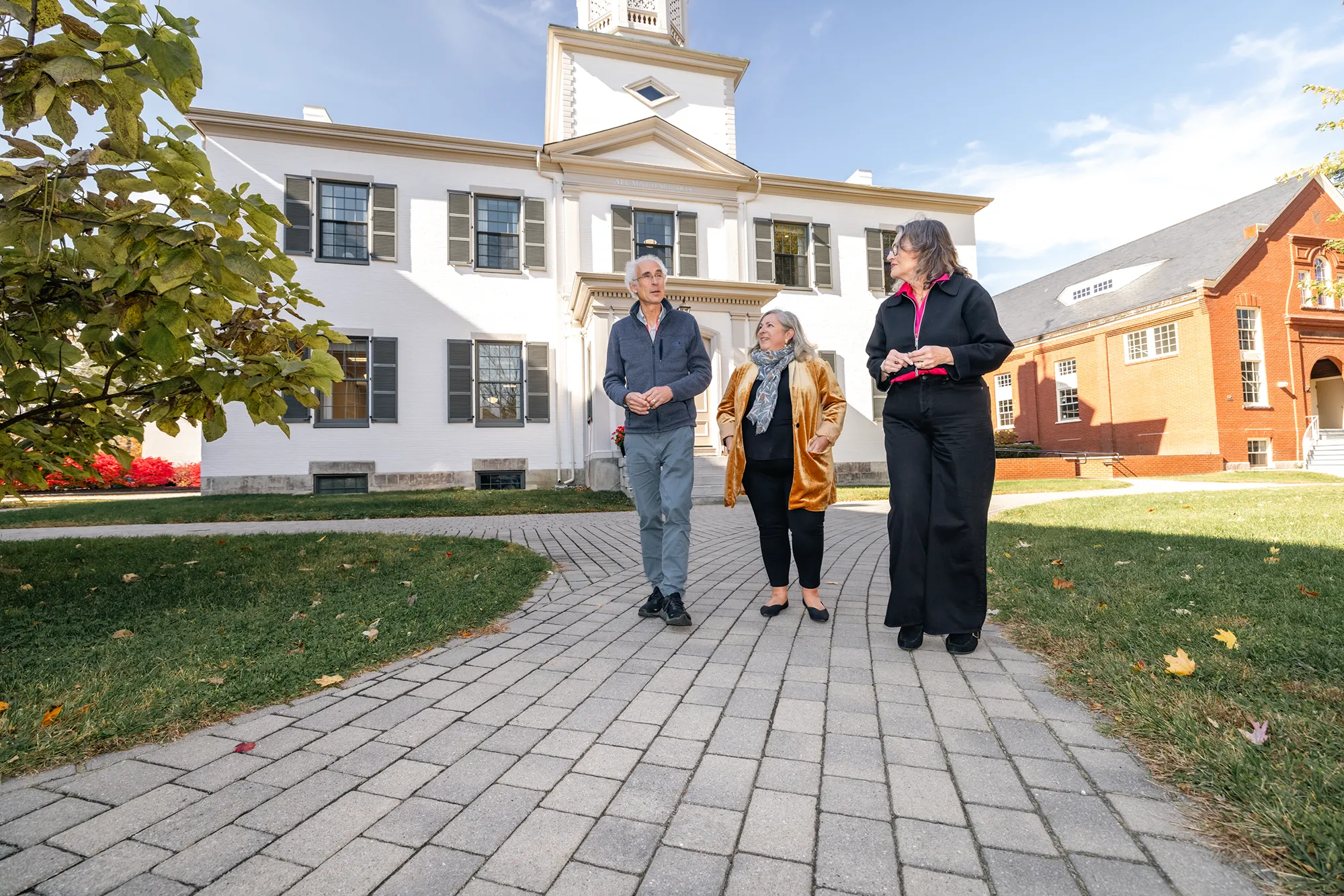 Clifford Rosen, M.D., MaineHealth Institute for Research; Gwendolyn Mahon, UNE; and Karen Houseknecht, UNE, stroll and speak about research collaborations