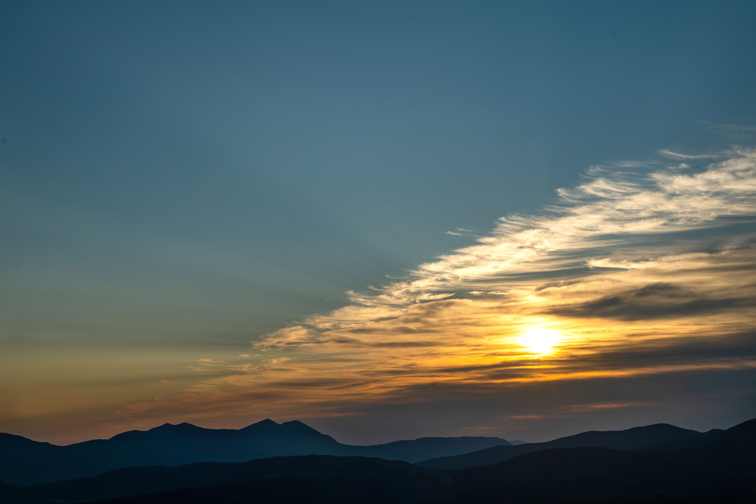 The sunrise over the Bigelow Preserve mountains