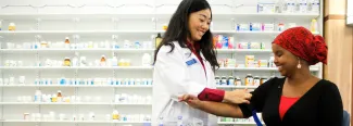 a pharmacy student takes a patient's blood pressure