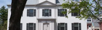 white brick building on u n e's portland campus