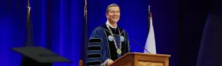 U N E President James Herbert speaking at Commencement