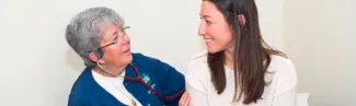 a student speakers with a student health center nurse