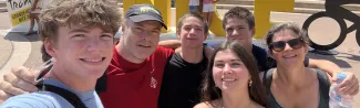 UNE's Norm O'Reilly poses with family in a plaza in Nice, France