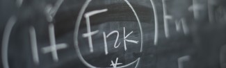 A chalkboard with mathematical equations