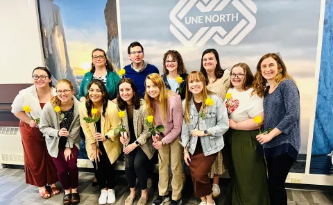 LEND trainees smiling with flowers