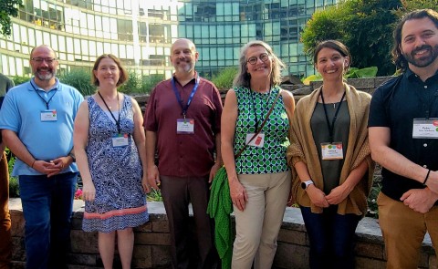 A group of UNE researchers poses outside at a conference in Washington, D.C.