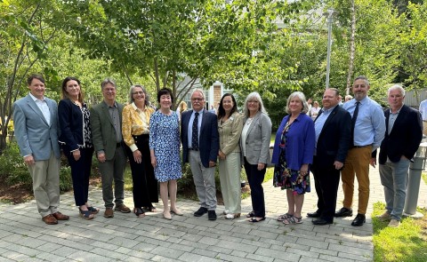 A group of Maine biomedical researchers poses with Sen. Susan Collins