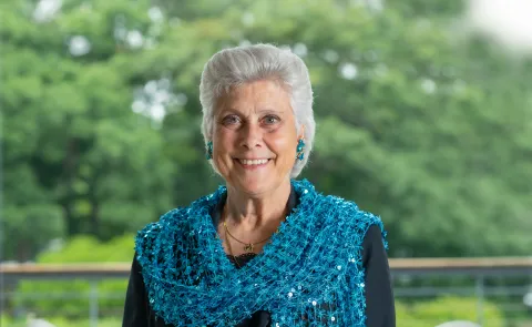 Portrait of Marilyn Gugliucci against trees on the Biddeford Campus