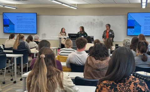 Three UNE occupational therapists give a classroom presentation