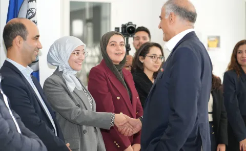 Ambassador Talwar greets a student