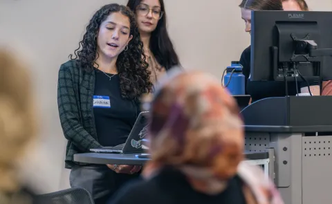 A group of students gives a slideshow presentation