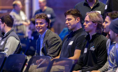 UNE students watch a panel discussion in Innovation Hall