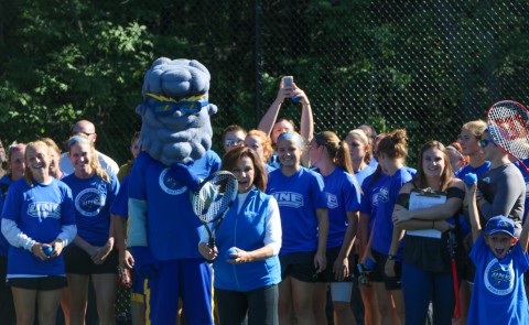 President Danielle Ripich delivers ceremonial First Serve at UNE's new tennis courts