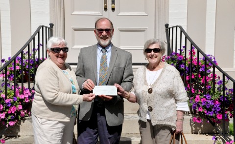 Judith Keegan Sturgeon WC ’49 and Jo Anne Vaughan Thomas Hall WC ’49 present a check to William Chance