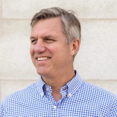 Headshot of U N E trustee Jim Brady