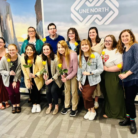 LEND trainees smiling with flowers