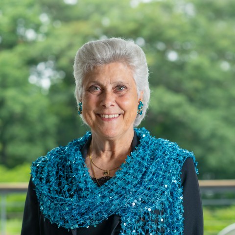 Portrait of Marilyn Gugliucci against trees on the Biddeford Campus