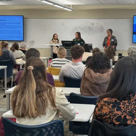 Three UNE occupational therapists give a classroom presentation