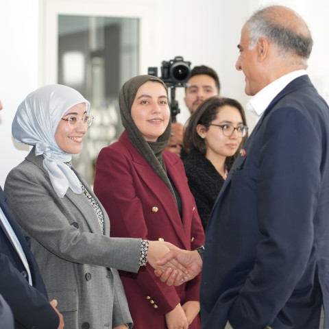 Ambassador Talwar greets a student