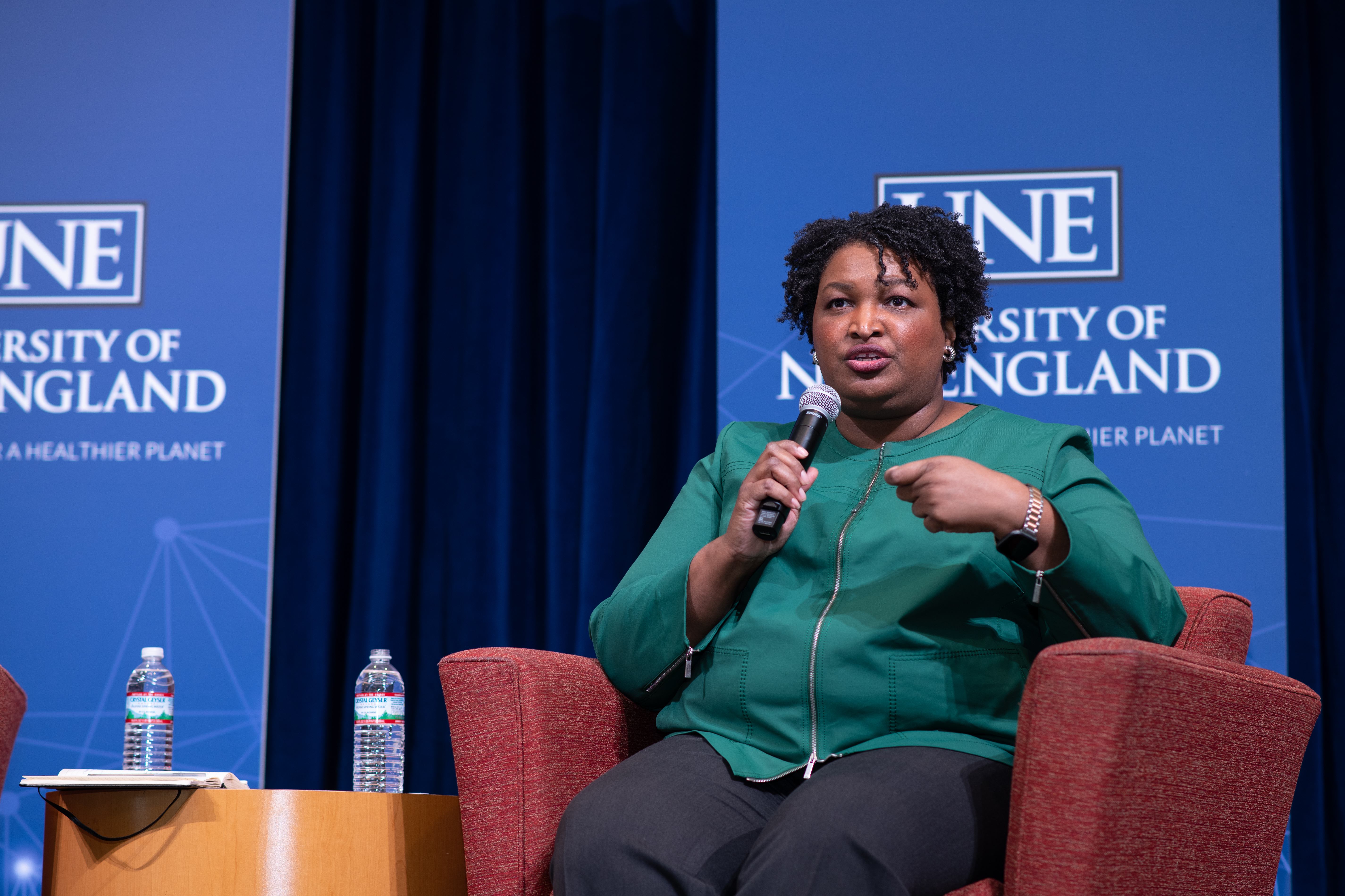 Stacey Abrams seated on stage